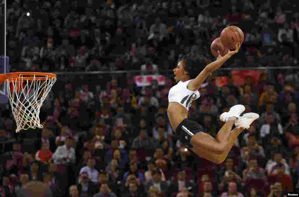 A member of Team Hype jumps to shoot during a performance at the NBA Global Games basketball match between Sacramento Kings and Brooklyn Nets in Beijing, China. 