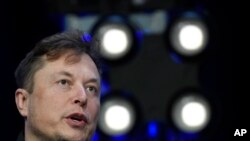 FILE - Elon Musk speaks at the SATELLITE Conference and Exhibition March 9, 2020, in Washington. Elon Musk is threatening to end his $44 billion agreement to buy Twitter, accusing the company of refusing to give him information about its spam bot accounts. 