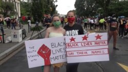 Veda Shook and daughter Isabelle of Washington participate in Juneteenth activities at Black Lives Matter Plaza, June 19, 2020. Isabella said the event signifies freedom for U.S. blacks, yet "the struggle is still on." (Saqib Ul Islam/VOA)