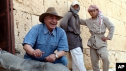 Zahi Hawass displays a Ptolemaic statue discovered at Taposiris Magna, in northern Egypt on 8 May, 2010.