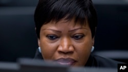 FILE - In this file photo dated Thursday, Chief Prosecutor Fatou Bensouda waits for the start of the trial against former Ivory Coast president Laurent Gbagbo at the International Criminal Court in The Hague, Netherlands. Bensouda says she is launching a preliminary investigation to establish if there is enough evidence to merit a full-blown investigation into deportations of hundreds of thousands of Rohingya Muslims from Myanmar into Bangladesh.