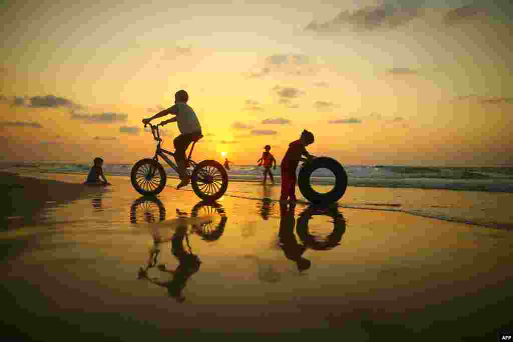 Palestinian children play on the beach in Gaza City.