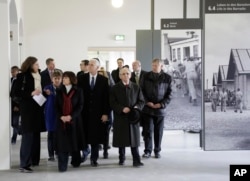 U.S. Vice President Mike Pence, fourth from left, and his wife Karen, third from left, visit the memorial site in the former Nazi concentration camp in Dachau near Munich, southern Germany, Feb. 19, 2017,