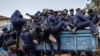 Hundreds of Congolese police join rebels in occupied city