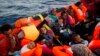 Migrants érythréens au cours d'une opération de sauvetage en mer Méditerranée, à environ 13 miles au nord de Sabratha, Libye, le lundi 29 août 2016. (AP / Emilio Morenatti)