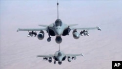 FILE - Jet fighters fly over Iraq in November 2014. 