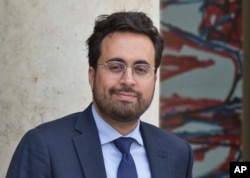 French Junior Minister for Digital Economy Mounir Mahjoubi leaves the Cabinet meeting at the Elysee Palace in Paris, Aug. 31, 2018.