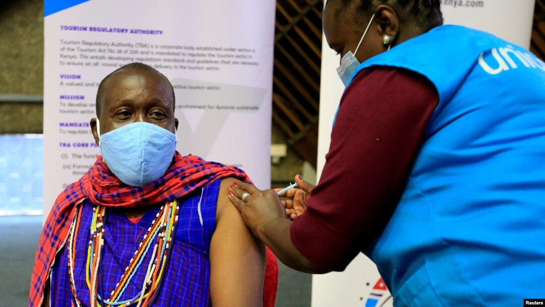 FILE - Kenyan tour guide, Daniel Ole Kissipan, receives a shot of the AstraZeneca/Oxford vaccine in Nairobi, Kenya, April 27, 2021.