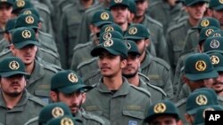 In this Feb. 11, 2019 file photo, Iranian Revolutionary Guard members attend a ceremony celebrating the 40th anniversary of the Islamic Revolution, at the Azadi, or Freedom, Square in Tehran, Iran.