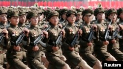 FILE - North Korea's Worker-Peasant Red Guard members attend a parade marking the 1948 establishment of North Korea, in Pyongyang, Sept. 9, 2013. 