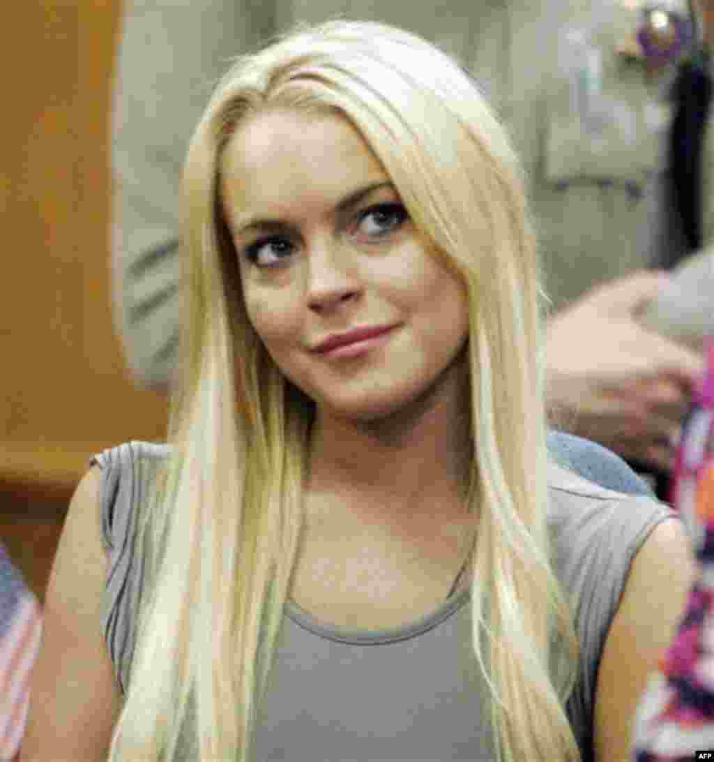FILE -- A July 20, 2010 file photo shows Lindsay Lohan in a court in Beverly Hills, Calif., where she was taken into custody to serve a jail sentence for probation violation. Lohan was discharged from a suburban Los Angeles jail early Monday, Aug. 2, 20