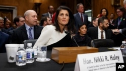 UN Ambassador-designate, South Carolina Gov. Nikki Haley, accompanied by her husband Michael, left, prepares to testify on Capitol Hill in Washington, Jan. 18, 2017, at her confirmation hearing before the Senate Foreign Relations Committee. 