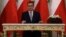 Newly appointed Polish Prime Minister Mateusz Morawiecki reacts after receiving his nomination from President Andrzej Duda during a government swearing-in ceremony in Warsaw, Poland, Dec. 11, 2017.