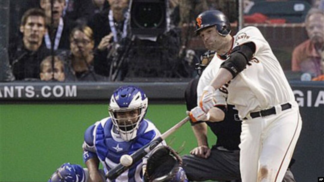 San Francisco Giants' Freddy Sanchez hits an RBI double to score Edgar Renteria in the third inning of Game 1 of baseball's World Series against the visiting Texas Rangers, 27 Oct 2010