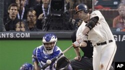 San Francisco Giants' Freddy Sanchez hits an RBI double to score Edgar Renteria in the third inning of Game 1 of baseball's World Series against the visiting Texas Rangers, 27 Oct 2010