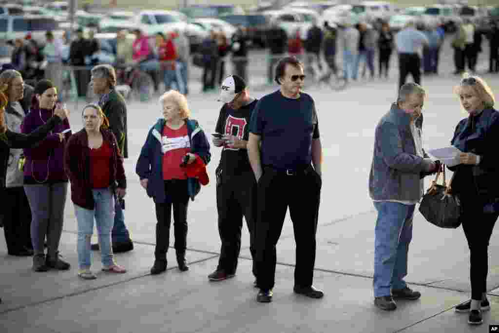 Voters line up outside a Republican caucus site, Feb. 23, 2016, in Las Vegas. 