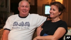 FILE - Roy Bennett, a senior Zimbabwean MDC opposition official, and his wife, Heather, relax at a friends home in Mutare, about 200 kilometers east of Harare, Zimbabwe, following his release from prison. A helicopter crash killed Bennett and his wife.