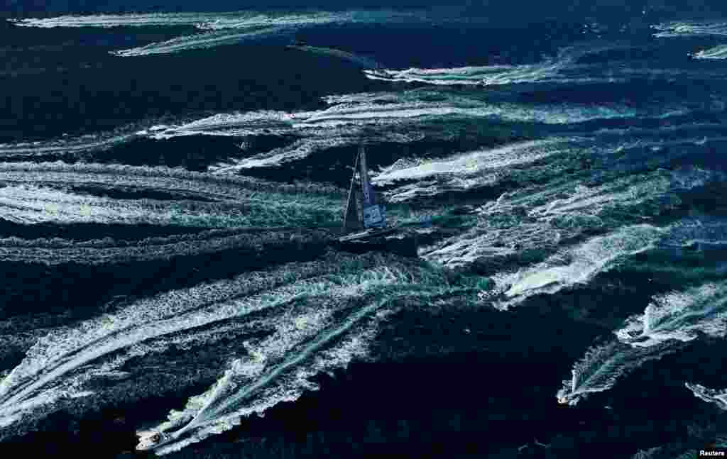 The Spirit of Portopiccolo sailboat leads during the Barcolana regatta in front of the Trieste harbor, Italy.