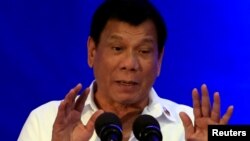FILE - Philippine President Rodrigo Duterte delivers a speech during the 80th National Bureau of Investigation anniversary, Nov. 14, 2016. On Thursday Duterte said he might withdraw from the International Criminal Court. 