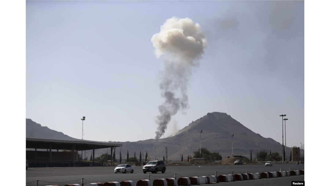 FILE - Smoke rises from an army weapons depot hit by a Saudi-led airstrike in al-Nahdain mountain in Yemen's capital, Sana'a, Oct. 25, 2015.