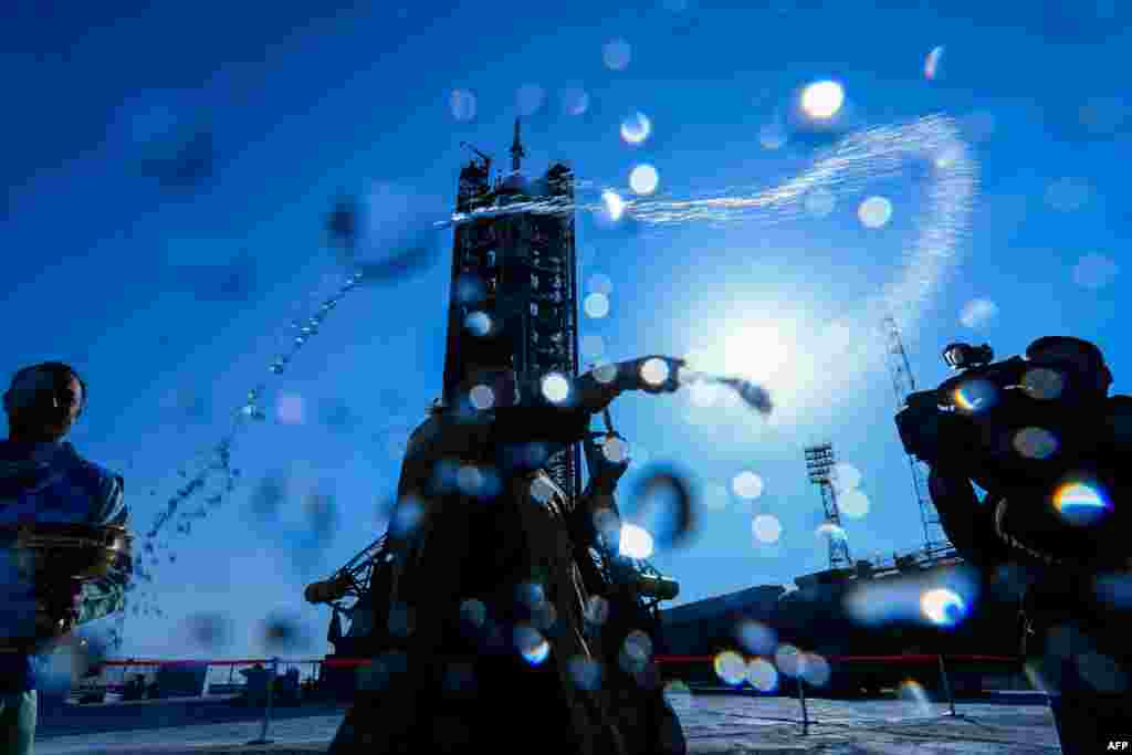 A Russian Orthodox priest blesses the Soyuz MS-12 spacecraft at the launch pad of the Russian-leased Baikonur cosmodrome in Kazakhstan.