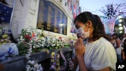 Relatives pray for victims of the Bali bombings during the commemoration of the 20th anniversary of the attack that killed 202 people, mostly foreign tourists, including 88 Australians and seven Americans, at the Bali Bombing Memorial Monument in Kuta, Bali, Indonesia, Oct. 12, 2022.