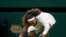Serena Williams falls to the ground during the first round women's singles on Centre Court at the Wimbledon Tennis Championships in London, June 29, 2021. (Peter Van den Berg-USA Today Sports)
