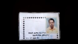 This March 17, 2021 photo shows a new ID card issued by Amhara authorities to Seid Mussa Omar, a 29-year-old Tigrayan nurse from Humera. Amhara authorities took his original ID card and burned it, he said. (AP Photo/Nariman El-Mofty)