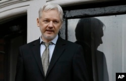 FILE - In this Feb. 5, 2016 file photo, WikiLeaks founder Julian Assange speaks from the balcony of the Ecuadorean Embassy in London.