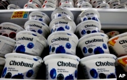 Chobani Greek yogurt sits on display in a market in Pittsburgh. One version has gotten smaller recently. (AP Photo/Gene J. Puskar)