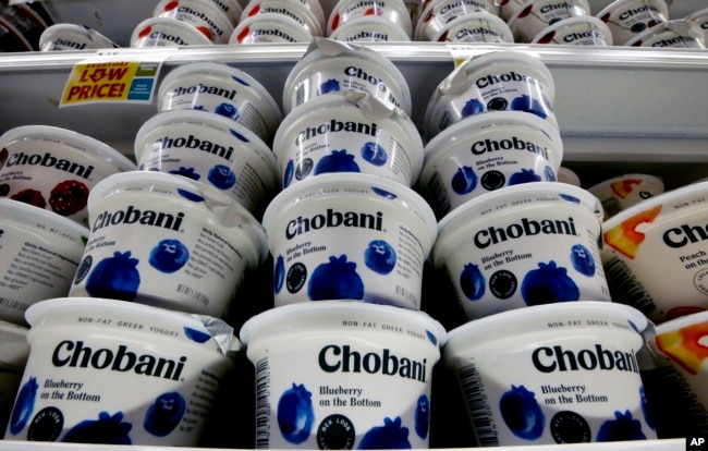 Chobani Greek yogurt sits on display in a market in Pittsburgh. One version has gotten smaller recently. (AP Photo/Gene J. Puskar)