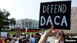 FILE _ Demonstrators protest in front of the White House after the Trump administration today scrapped the Deferred Action for Childhood Arrivals (DACA), Sept. 5, 2017.