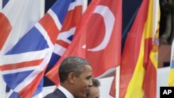 U.S. President Barack Obama (L) walks with French President Nicholas Sarkozy, after Obama's arrival at Espace Riviera for the G20 summit in Cannes, France, November 3, 2011.