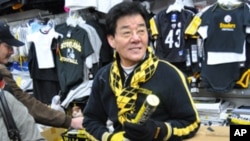 Ross Lee wearing Steeler colors at his store in Pittsburgh