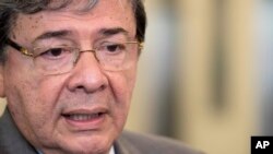 FILE - Colombian Foreign Minister Carlos Holmes Trujillo speaks to reporters, Aug. 23, 2018, at U.N. headquarters.