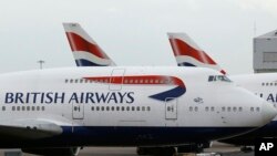 FILE - British Airways planes are parked at Heathrow Airport in London, Britain, Jan. 10, 2017.