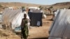 FILE - Asqual Helwa is seen at the Um Rakuba refugee camp, which houses Ethiopians fleeing the fighting in the Tigray region, at the border in Sudan, Nov. 28, 2020.