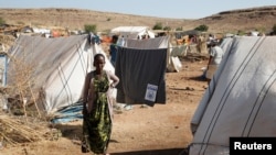 FILE - Asqual Helwa is seen at the Um Rakuba refugee camp, which houses Ethiopians fleeing the fighting in the Tigray region, at the border in Sudan, Nov. 28, 2020.