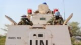 FILE - U.N. peacekeepers in an armored personnel carrier lead a patrol from Bentiu toward the village of Nhialdiu, South Sudan, Dec. 7, 2018.