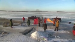 Annual Winter Fishing Festival Under a Frozen Lake in China