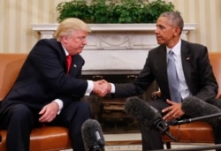 FILE - Then-President Barack Obama and President-elect Donald Trump shake hands following their meeting in the Oval Office of the White House in Washington, Nov. 10, 2016.