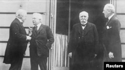 British Prime Minister David Lloyd George, Italian Premier Vittorio Emanuele Orlando, French Premier Georges Clemenceau and President Woodrow Wilson are seen in Versailles.
