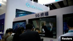 A Qualcomm sign is seen at the 2ns China International Import Expo (CIIE) in Shanghai, Nov. 6, 2019. 