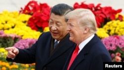 U.S. President Donald Trump and China's President Xi Jinping attend a welcoming ceremony in Beijing, Nov. 9, 2017. 