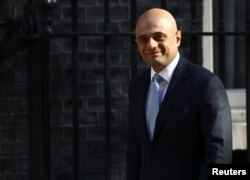 FILE - Sajid Javid, then Britain's home secretary, arrives in Downing Street in London, May 1, 2018.