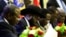 President of South Sudan, Salva Kiir signs a final power-sharing deal between South Sudanese arch-foes, Aug. 5, 2018, in Khartoum.