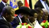 FILE - President of South Sudan Salva Kiir signs a final power-sharing deal between South Sudanese arch-foes in Khartoum, Sudan, 8.5.2018