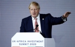 Britain's Prime Minister Boris Johnson gestures as he speaks at the UK-Africa Investment Summit in London, Britain, Jan. 20, 2020.