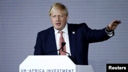 Britain's Prime Minister Boris Johnson gestures as he speaks at the UK-Africa Investment Summit in London, Jan. 20, 2020. 