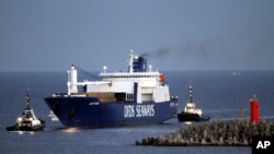 FILE - The Danish cargo ship Ark Futura, carrying 1,300 tons of Syrian chemical weapons to be destroyed, arrives at Gioia Tauro port, southern Italy, July 2, 2014.